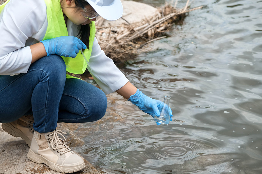 Scientist takes a water sample