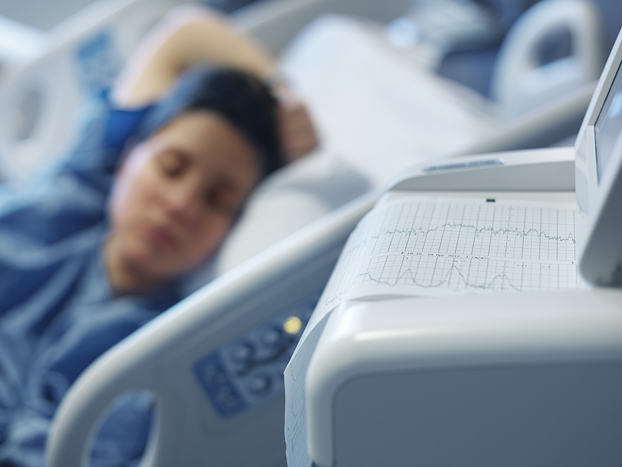 Woman lying in a hospital bed