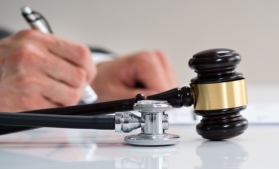 Gavel and stethoscope in courtroom