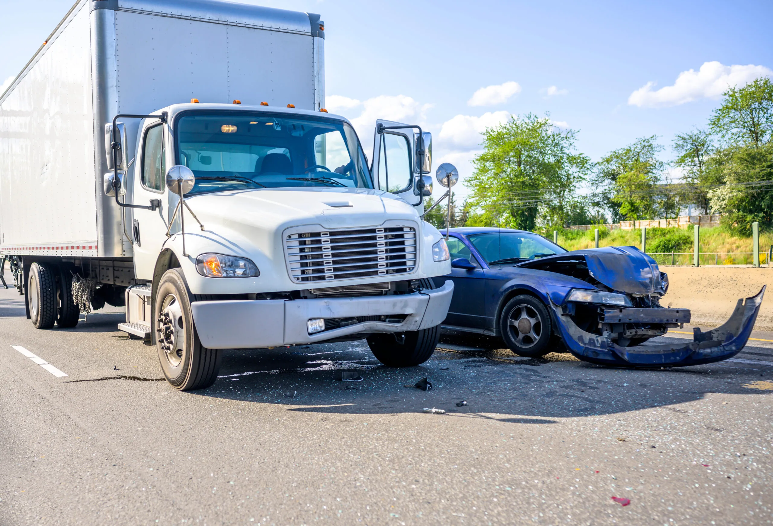 A semi truck collision with a passenger automobile