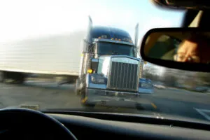 Imminent head-on collision between a semi and a car