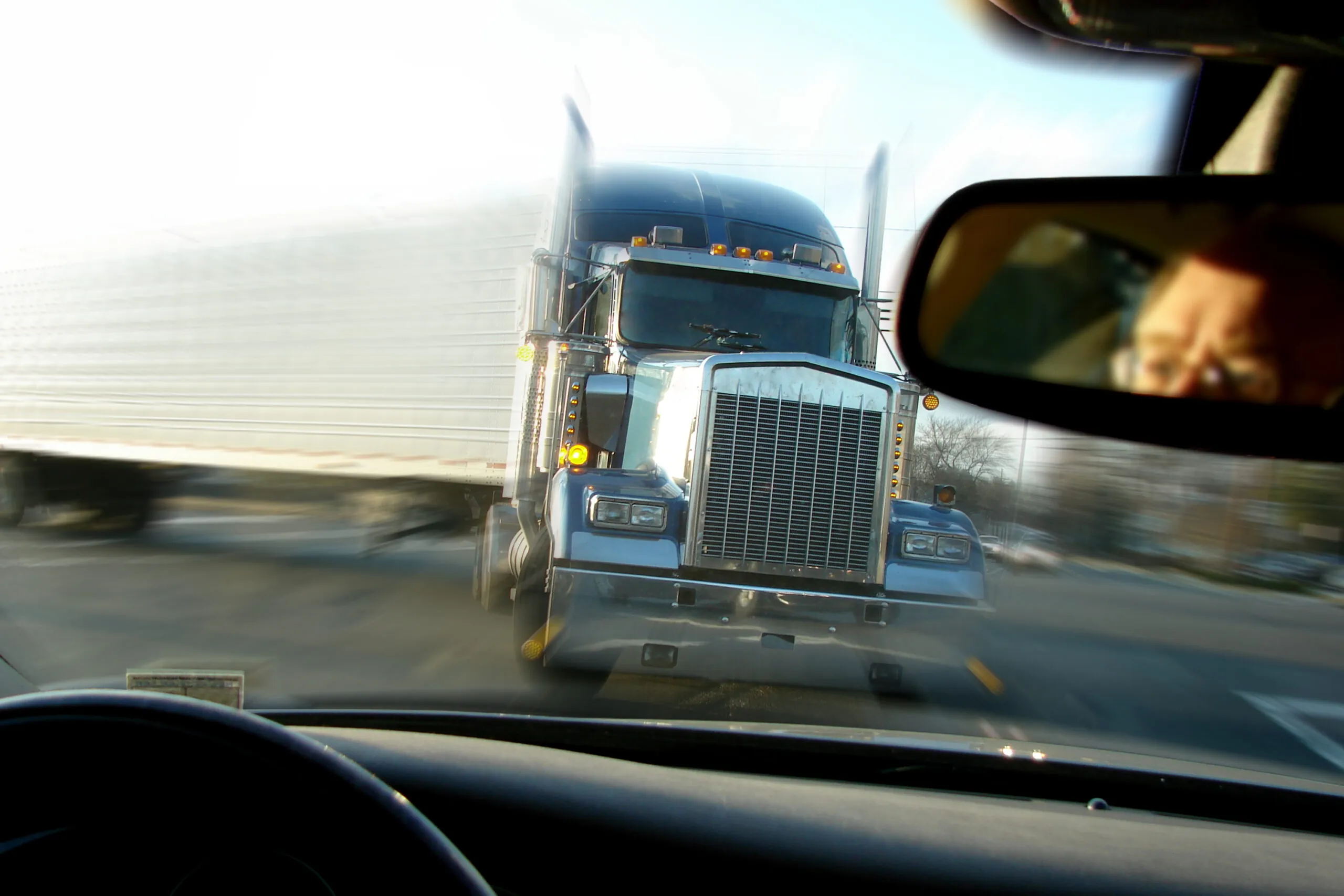 Imminent head-on collision between a semi and a car